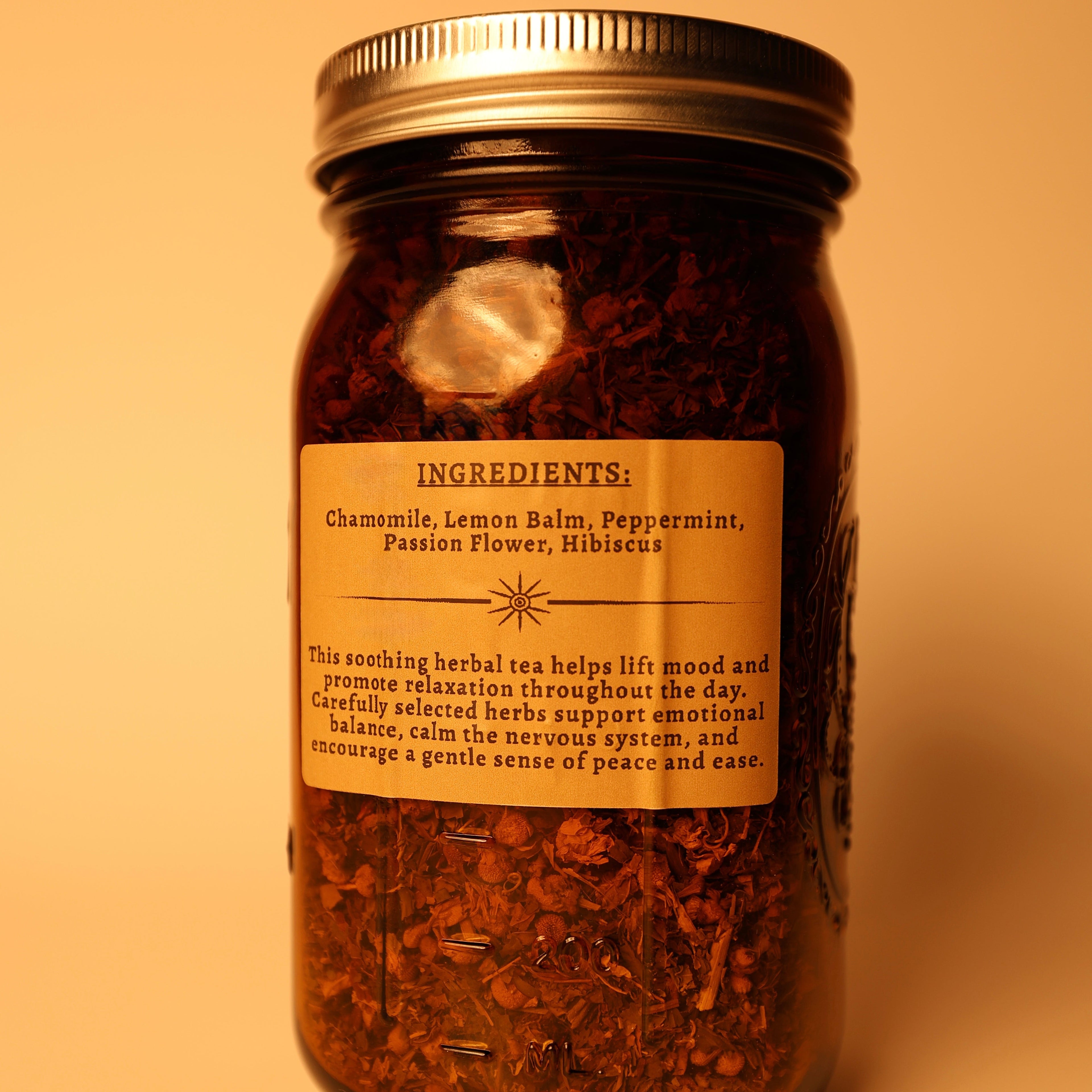 Deep Calm tea jar ingredients label - chamomile, lemon balm, peppermint, passion flower. A tea sold by MadMuchLove Holistic Healing. 
